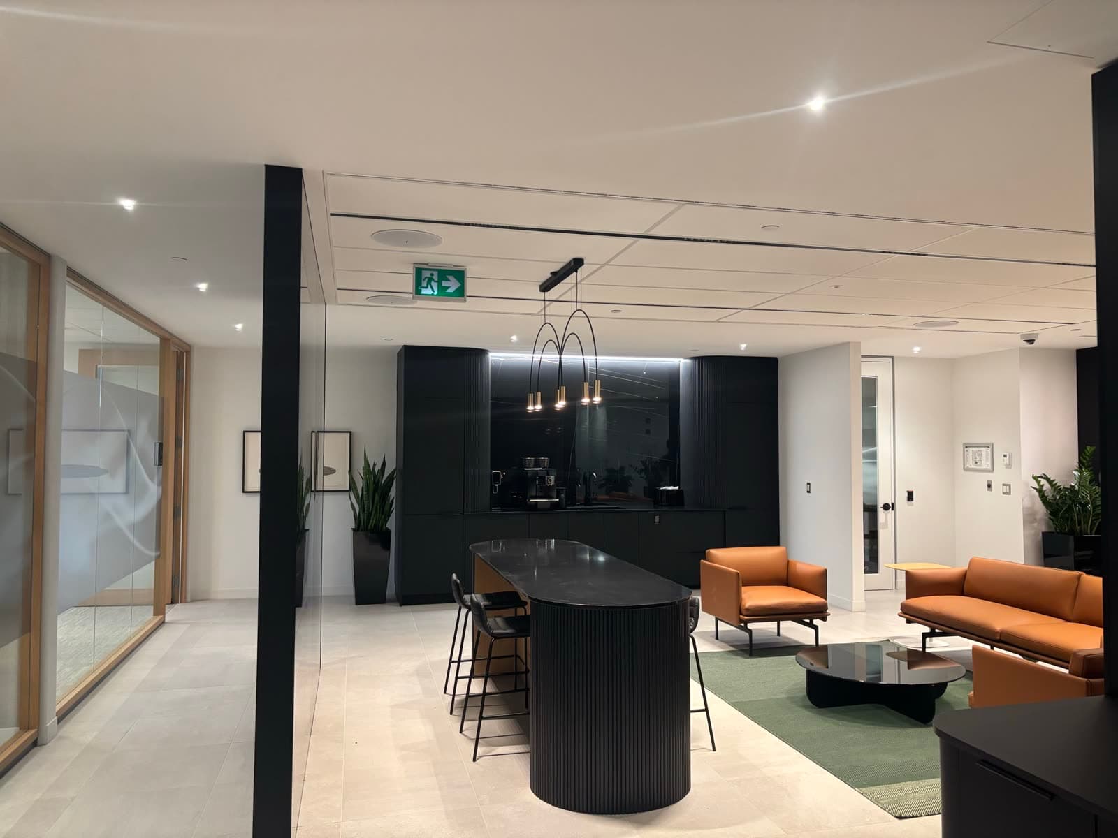 Office lounge and kitchen — decorative pendants, recessed lighting and cove detail